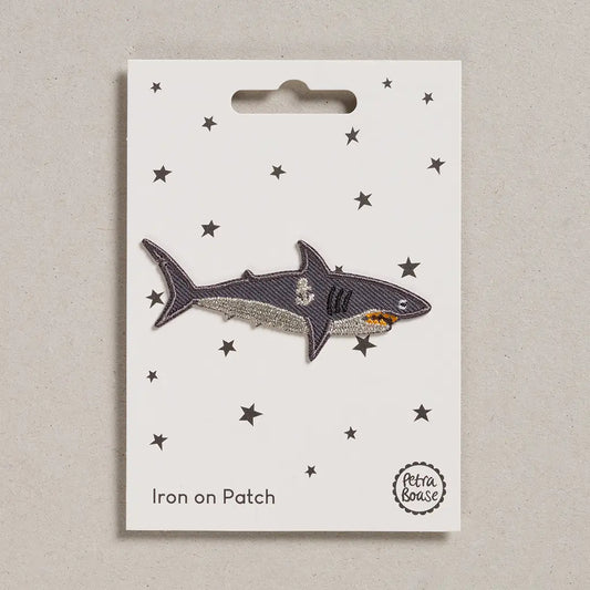 Shark iron on patch on a card with star patterns, brand 'Petra Boase' visible