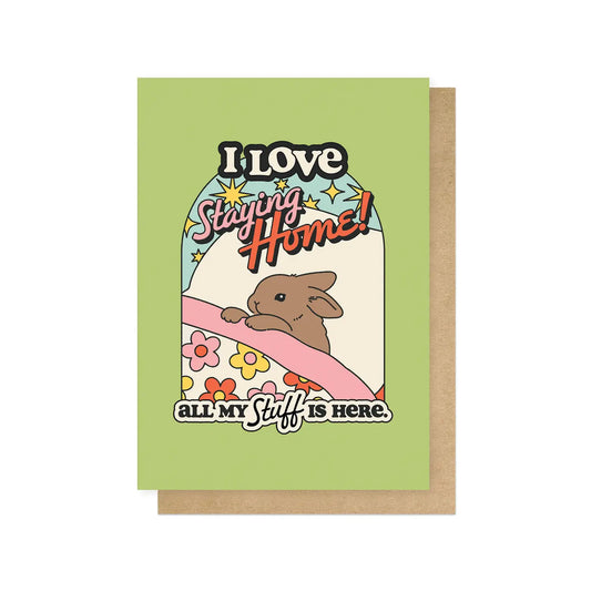 Card with a rabbit illustration and text 'I Love Staying Home! All My Stuff is Here.' on a green background.