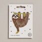 Iron on patch of a sloth on a white card with 'Petra Boase' branding.