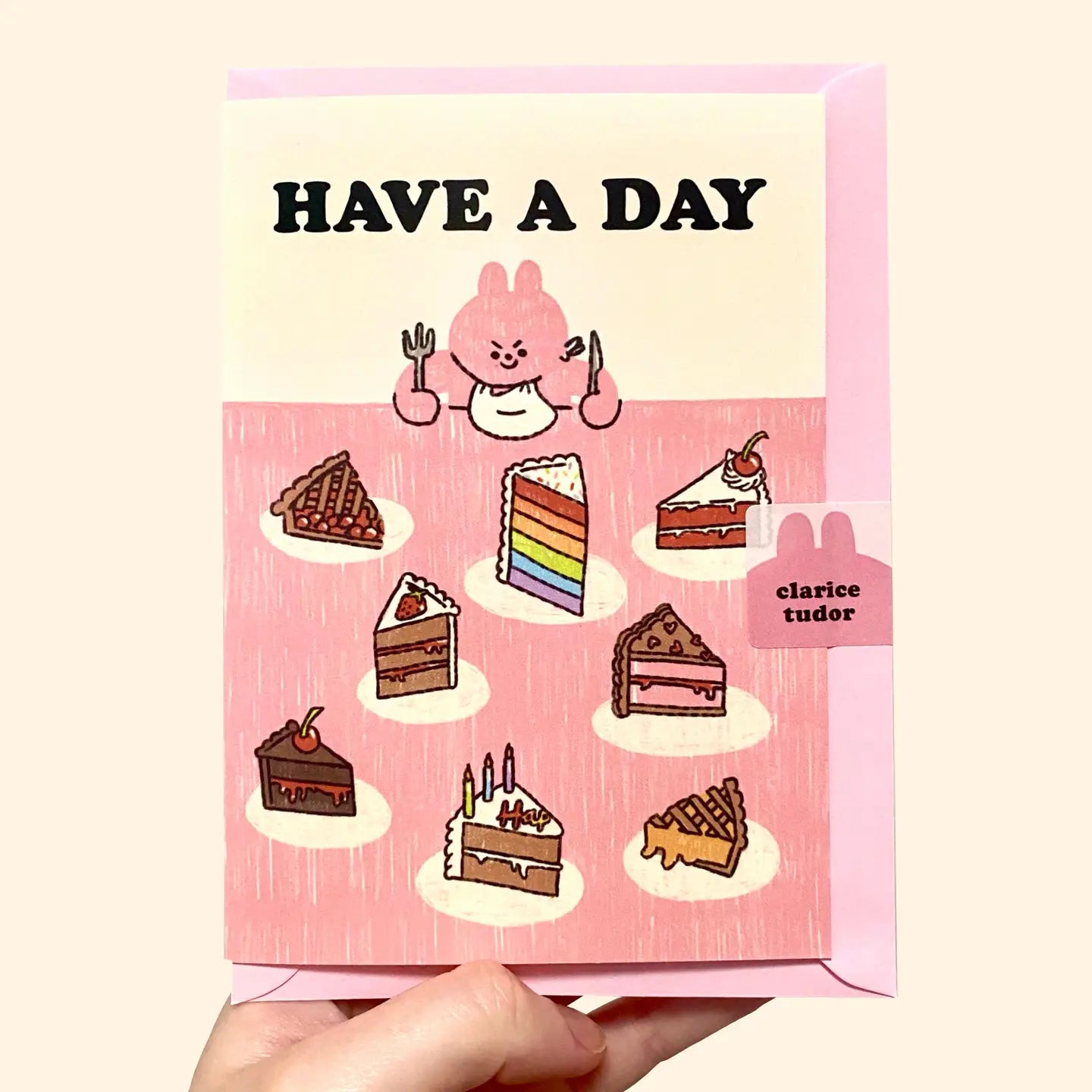 Card with cartoon character and cake illustrations with 'Have a Day' text