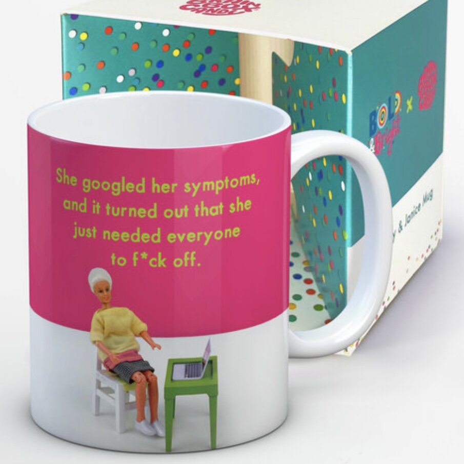 A pink and white mug with an image of a woman sat at a desk on her laptop. The text above on the mug reads: ' She googled her symptoms, and it turned out that she just needed everyone to f*uk off.'