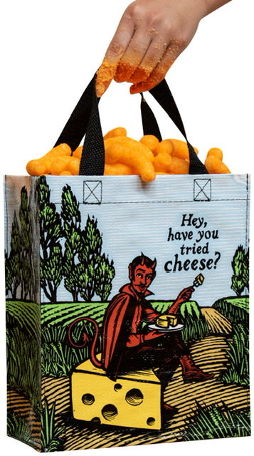 A Blue Q Have you tried cheese lunch bag filled with cheese puffs. There is a hand holind the bag that is covered in cheese puff dust. 