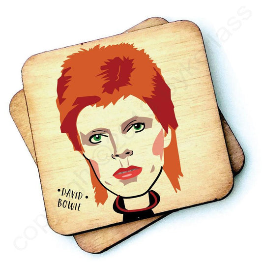 Image shows a wooden drinks coaster with a cartoon graphic of David Bowie on the front