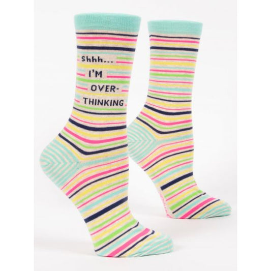 Blue Q socks with blue, black, pink, green and yellow horizontal stripes. The text reads ‘shhh... i'm overthinking’