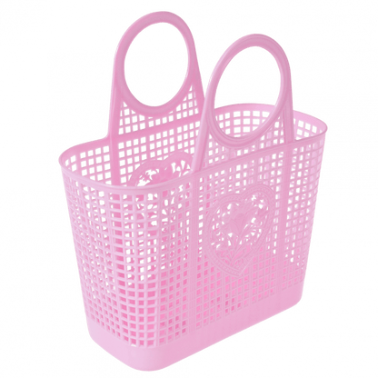 A pink plastic basket with a love heart and flower design on on the front 