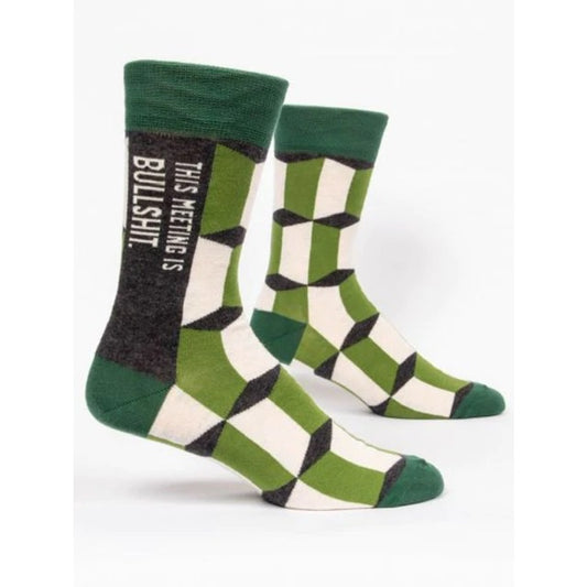 Green pair of socks with Dark green, Light green and white geometric pattern on the front. The text on the socks reads: 'This meeting is bullshit'