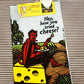 A Blue Q tea towel with the devil sat on a block of cheese in a field. 'Hey, have you tried cheese?'