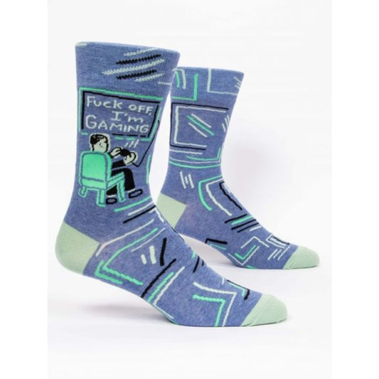 Blue Q socks with a man on a computer. The socks are blue and have text on the screen that reads ‘Fuck off I’m gaming’