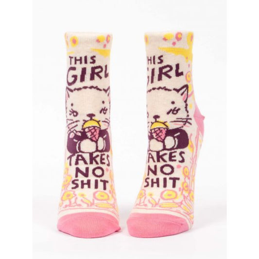 Pink and yellow Blue Q socks with a picture of a cat eating ice cream. The text reads ‘this girl takes no shit’