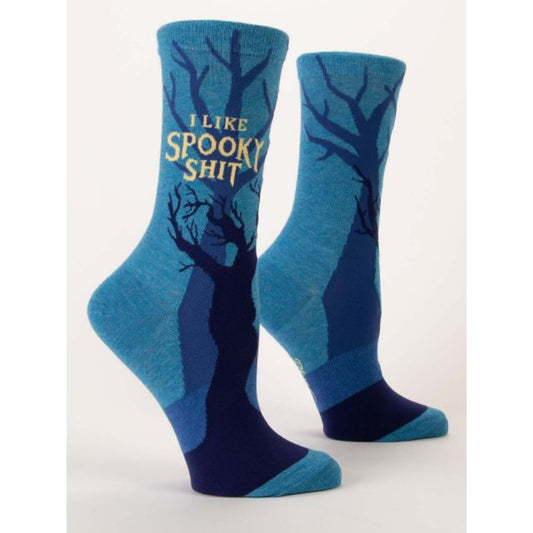 Blue Q socks that are blue with dark and mysterious trees all over. The text on the socks reads ‘I like spooky shit’