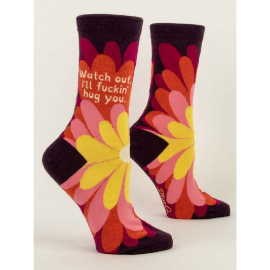 Burgundy Blue Q socks with big yellow, pink and red flowers on the front. The text reads ‘watch out I'll fuckin hug you’