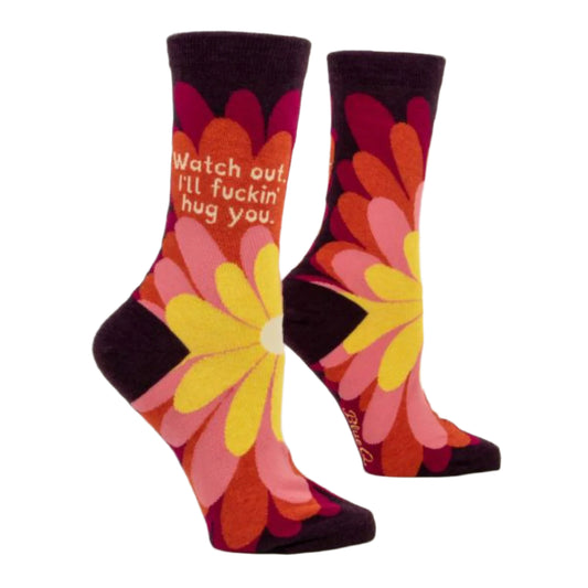 Burgundy Blue Q socks with big yellow, pink and red flowers on the front. The text reads ‘watch out I'll fuckin hug you’