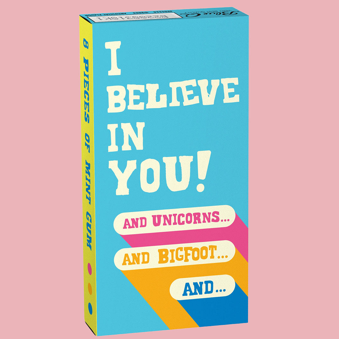 A blue box of Blue Q gum that reads: I believe in you! and unicorns... and bigfoot... and...