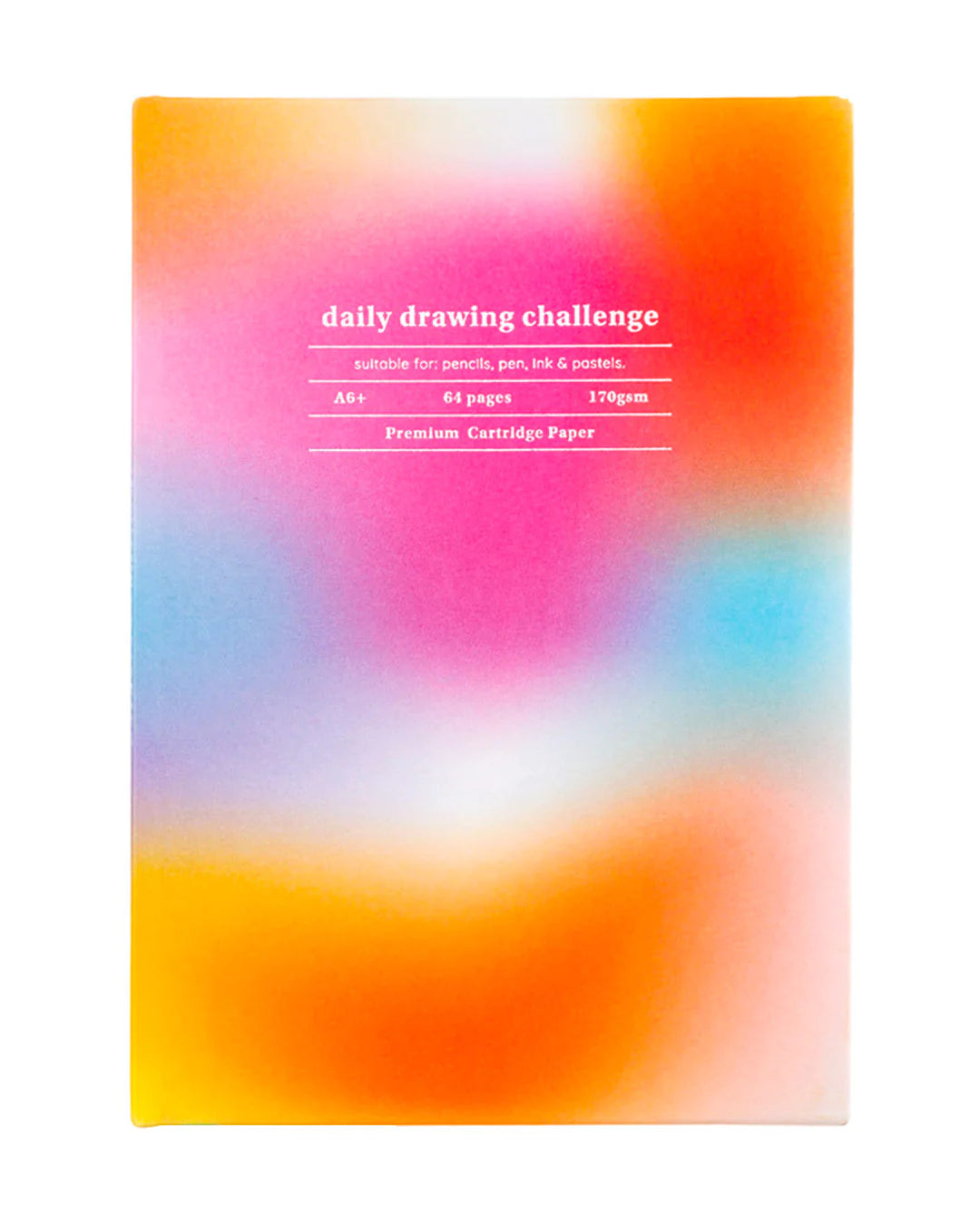 A blur of pink, red, blue and orange on the front of a drawing book . The text on the book reads : daily drawing challenge. Suitable for: pencil, pen, ink and pastels. A6+ 64 pages 170 gsm Premium cartridge paper  