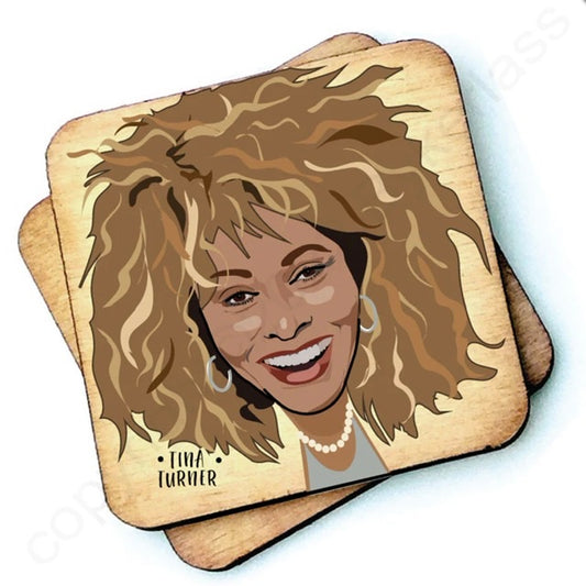 Image shows a wooden drinks coaster with a cartoon graphic of Tina Turner on the front