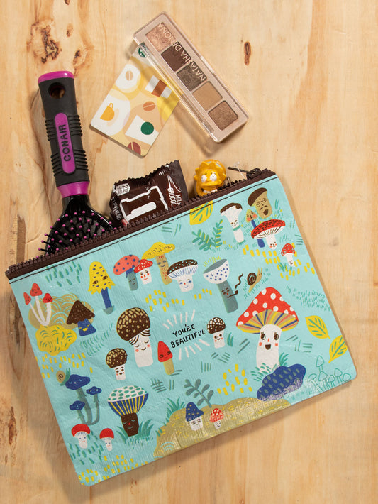 A Blue Q zipper pouch with cute little cartoon mushrooms on the front. The text reads: 'You're beautiful'
