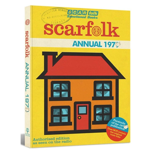 A yellow book with a red and orange house on the front with eyes peering through the windows. The text omn the book reads: Scarfolk annual 197- Authorised edition as seen on the radio