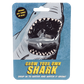 A small toy shark encases in a blue cardboard packaging with a picture of a shark on. The text on the packaging reads: Grow your own shark - Grows six times in size! - drop in water and watch it grow!