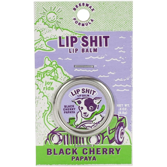 A Blue Q lip shit tin encased in cardboard packaging . The text reads: 'Lip shit lip balm - Black cherry papaya’