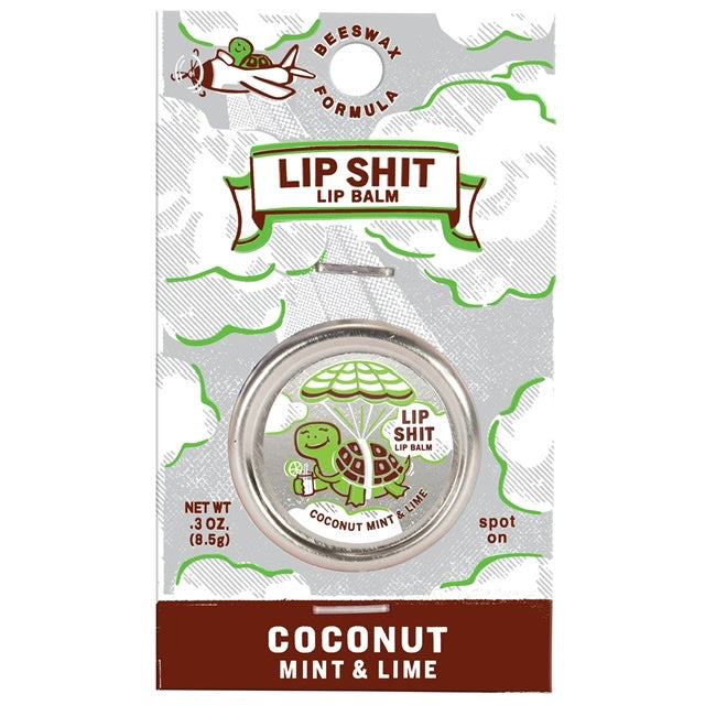 A Blue Q lip shit tin encased in cardboard packaging. The text reads: 'Lip shit lip balm - Coconut mint and lime'