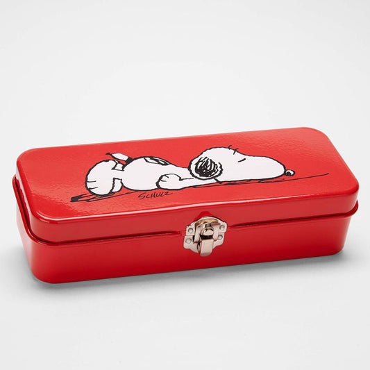 A red tin with a silver clasp on the front. On the front of the tin there is a graphic of Snoopy laying down with his face on the floor. 