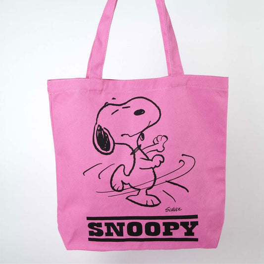 A pink tote bag with a graphic of Snoopy dancing on the front. The text on the bag reads: Snoopy 