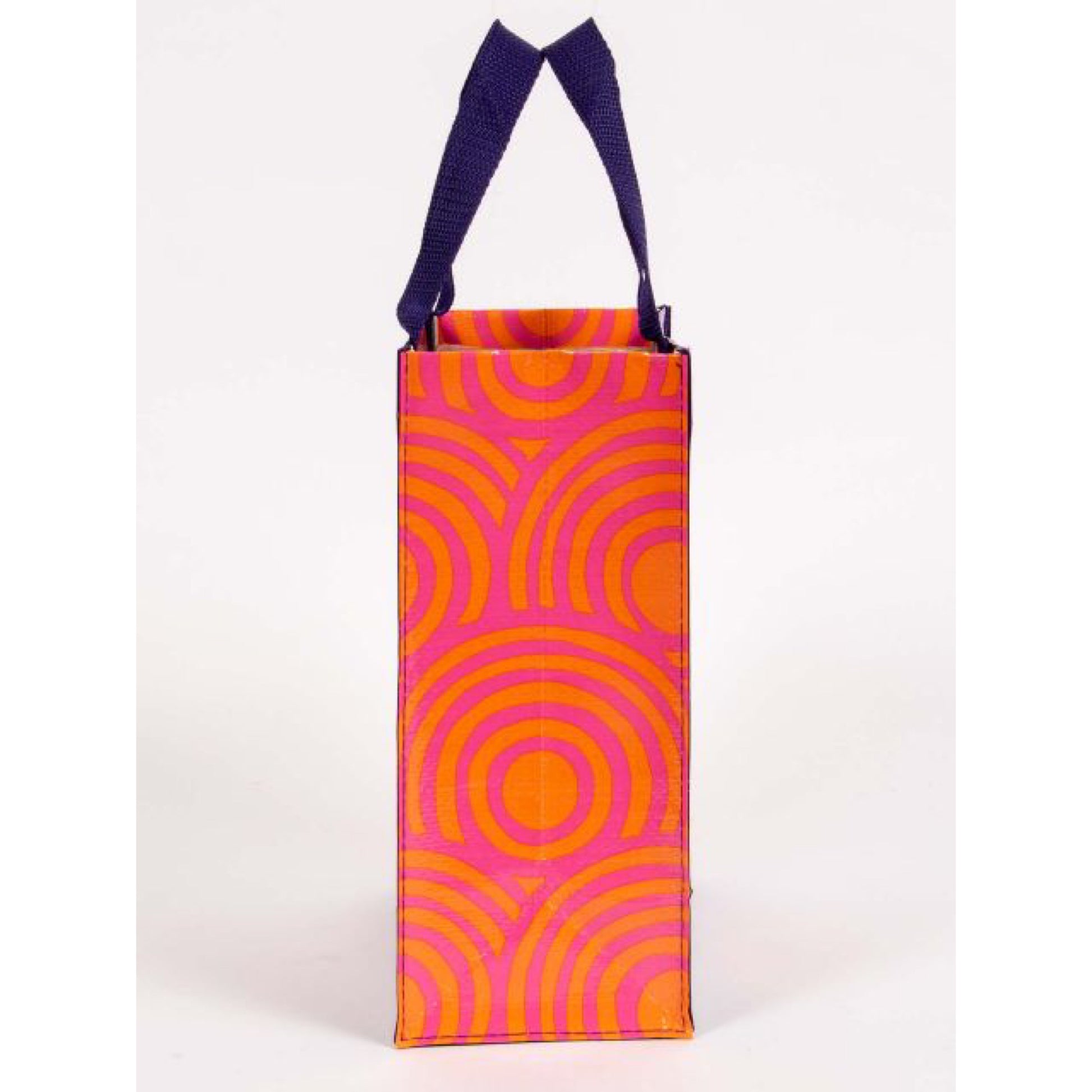 Blue Q munchies lunch bag with a orange and pink circled pattern on the side.