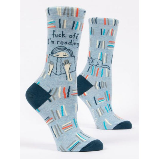 Blue Q socks with red, white and blue stripes. They feature a girl reading and the text reads fuck off i'm reading