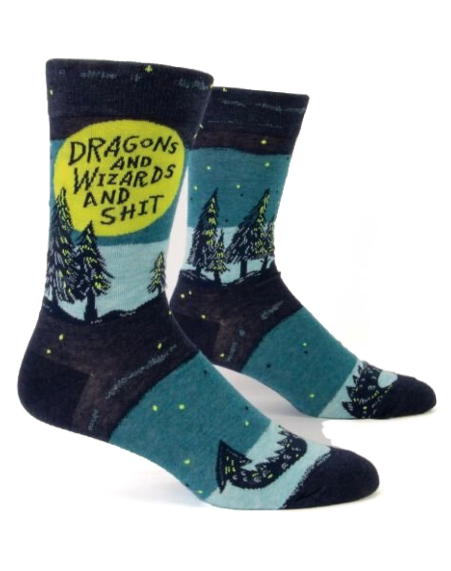 Image shows blue and green men's socks with a graphic showing a forest and a dragons tail. The text on the socks says dragons and wizards and shit