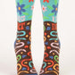 Blue Q women's socks with colourful flowers and worms printed all over. The text on the socks reads ‘i dig dirt’ 