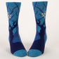 Blue Q socks that are blue with darker blue mysterious trees silhouettes all over. 