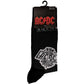 Image shows pair of black socks with grey stripes with AC DC logo on them with text saying back in black